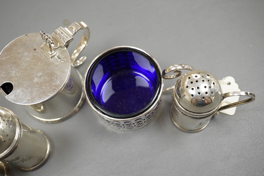 Five assorted silver condiments including a mustard pot and a pair of pepperettes, Birmingham, 1935, 79mm. Condition - fair